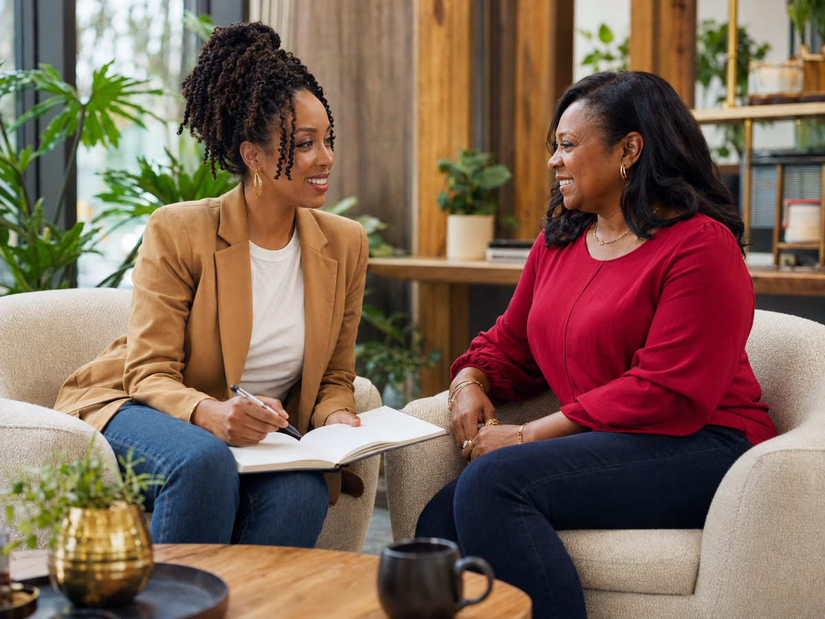 Warm coaching consultation between two Black women