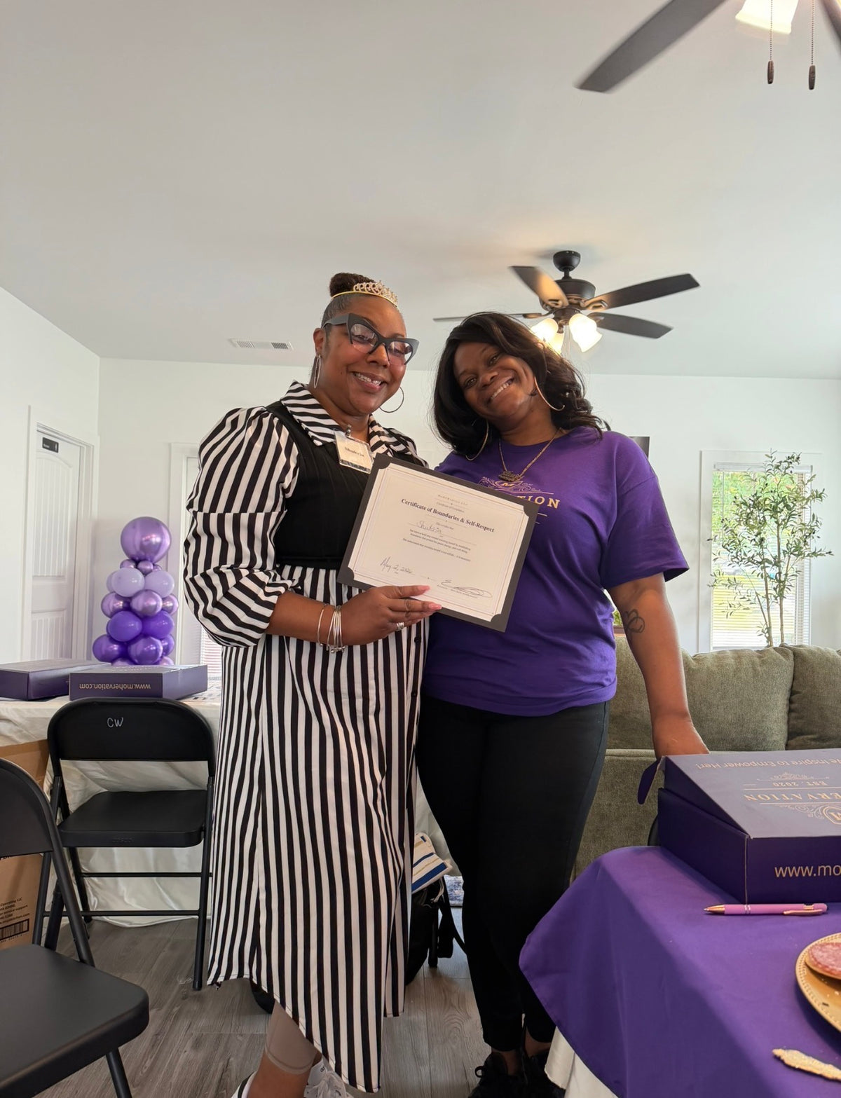 Ebony celebrating a woman at a MoHERvation gathering